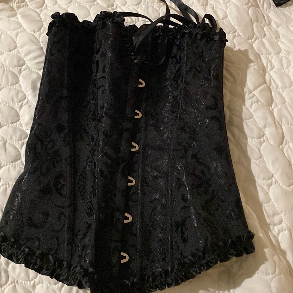 Black corset, small never worn too lose for me.
